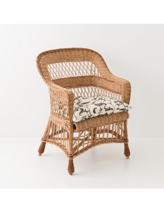 Fauteuil en osier Lora avec coussin fond gris feuillage blanc