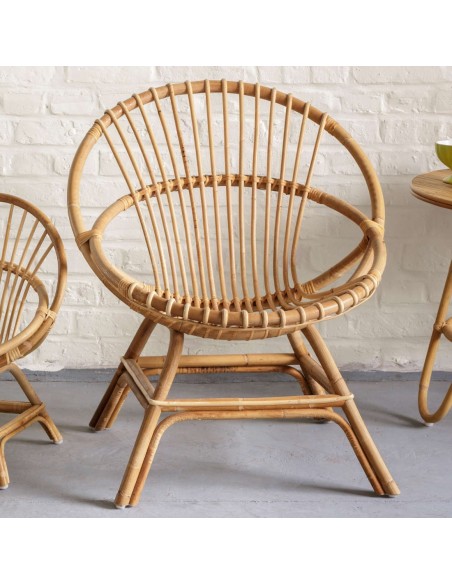 Ambiance fauteuil rotin coquille Brigitte en canne naturelle de chez KOK Maison