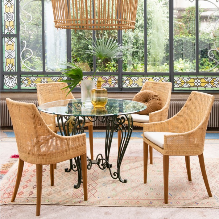 Rattan cane chairs around a table from the Saigon collection by Kok maison