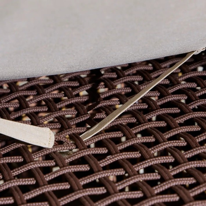 Zoom in on the cushion attachment for the TALI outdoor footstool