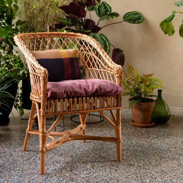 Antonin openwork wicker armchair in ambience with optional velvet cushion