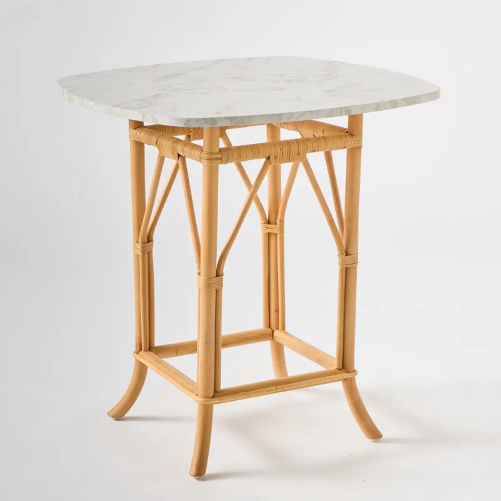 Eugénie table in natural rattan with white marble-effect laminate top