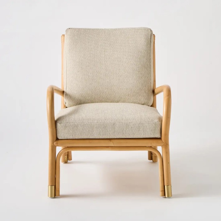 Front view Riviera rattan armchair grey chenille base fabric