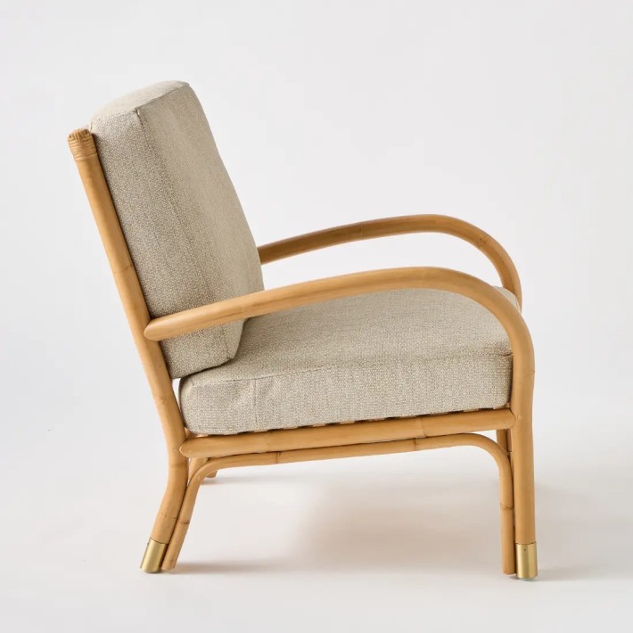 Side view Riviera rattan armchair grey chenille base fabric