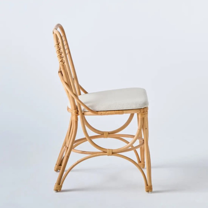 Profile view of Gingko rattan chair with fabric seat