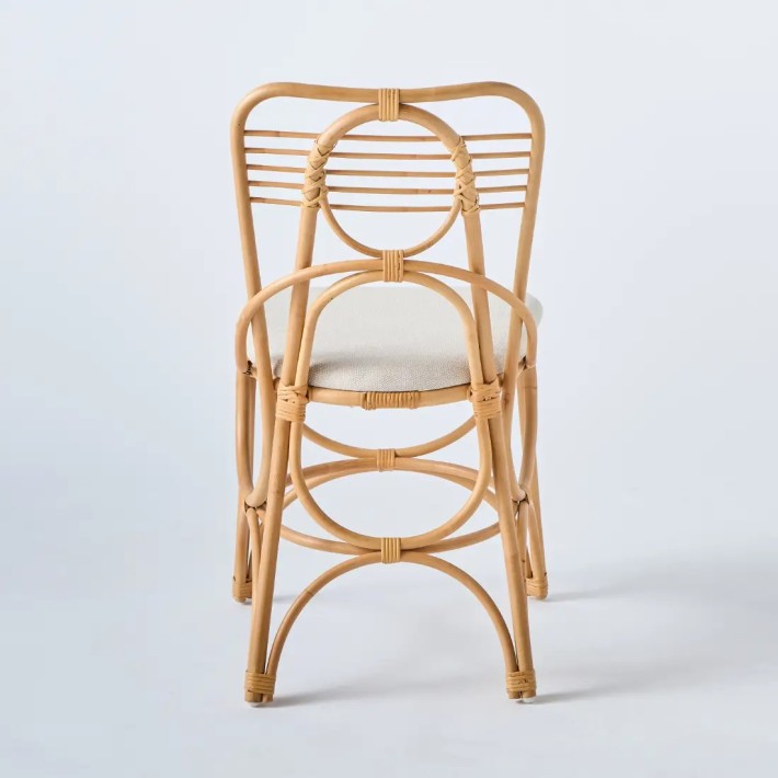 Back view of Gingko rattan chair with fabric seat, edition 2025