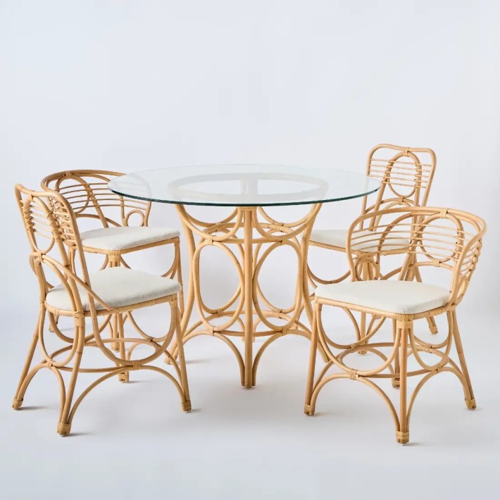 Gingko round dining table in rattan with glass top and Horizon chair and armchairs