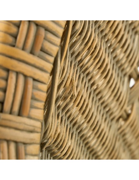 Detail of a flaw in the rattan of a Marcel armchair with a patina finish