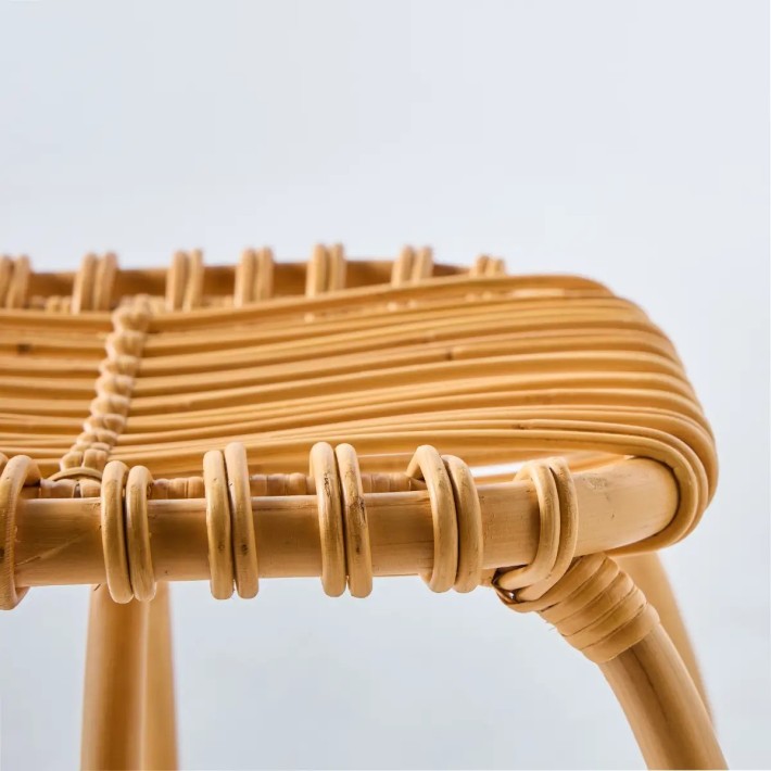 Profile detail of the 100% rattan Boucle collection footrest