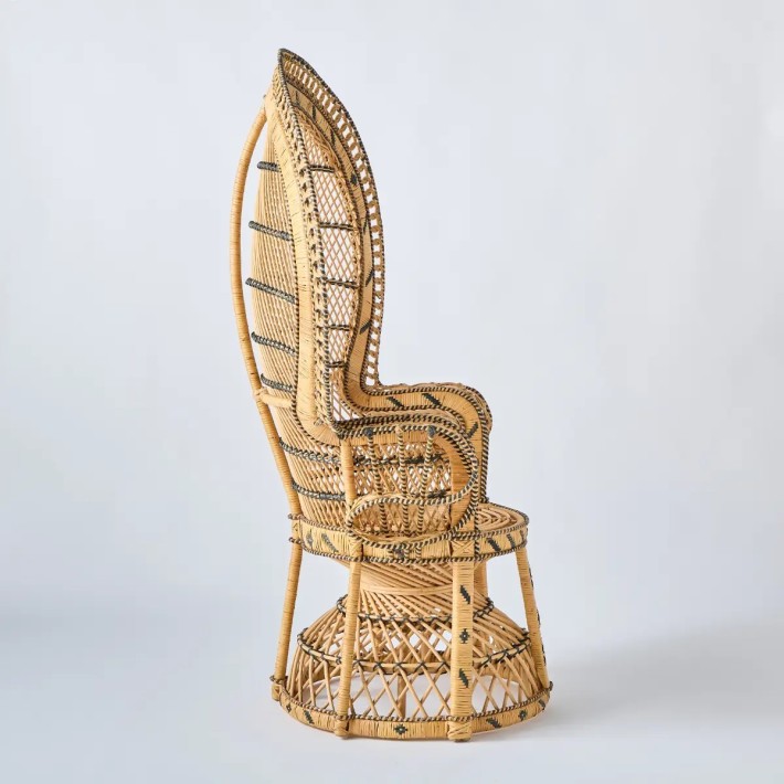 Profile of the iconic Emmanuelle rattan armchair