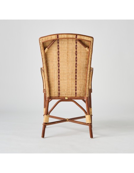 Back of the Bagatelle collection high-backed armchair in rattan with red edging