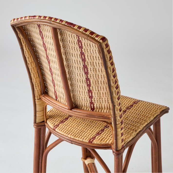Detail of the back of a woven rattan chair from the Bagatelle collection