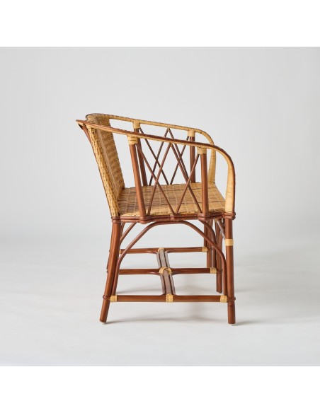 Side view of Bagatelle rattan bench Brown rattan frame with light rattan weave and red edging