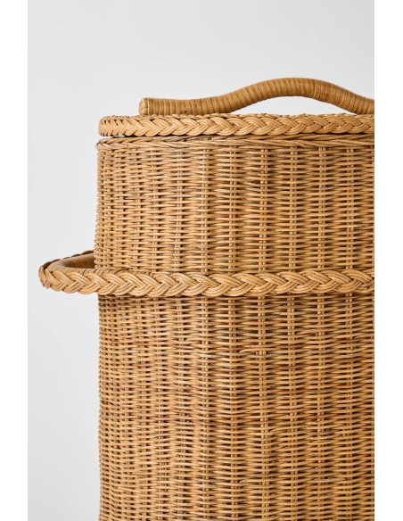 Detail of rattan weaving on the handle of a large rattan laundry basket
