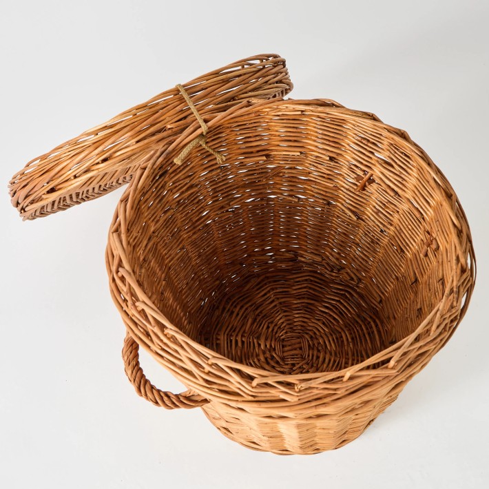 Interior view of vintage wicker storage basket from the KOK MAISON workshop archive