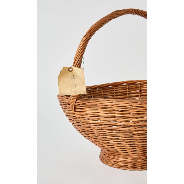 Vintage label, evidence of the past of this large homemade wicker basket