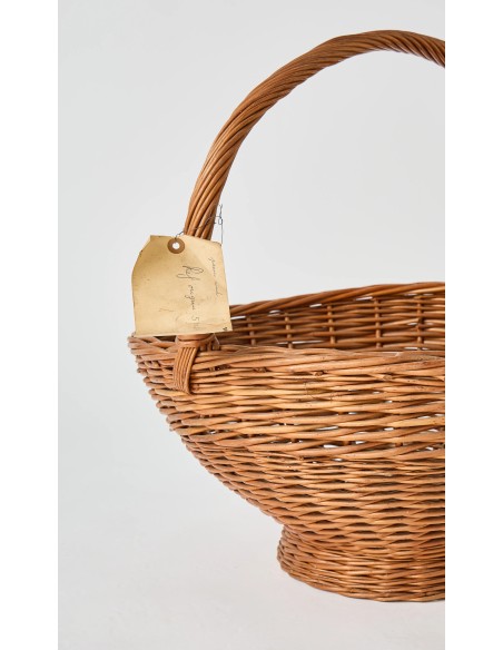 Vintage label, evidence of the past of this large homemade wicker basket