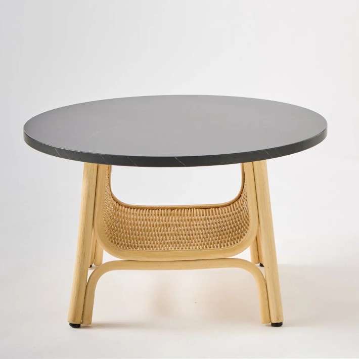 Interior view of CORRIDOR rattan coffee table basket from the ORCHID EDITION collection with black marble-effect laminate top