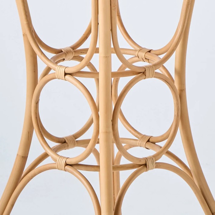 Detail of rattan cane on the leg of a gingko dining table, diameter 70 cm