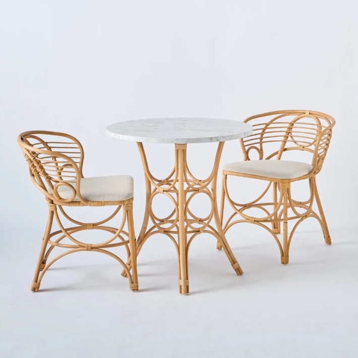 Dining table set with gingko dining armchairs in natural rattan cane at KOK maison