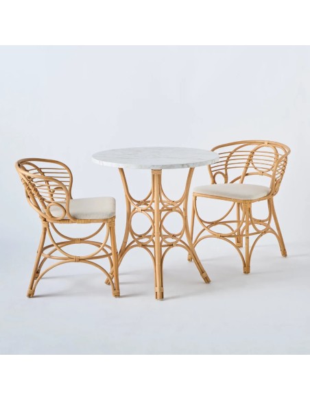 Dining table set with gingko dining armchairs in natural rattan cane at KOK maison