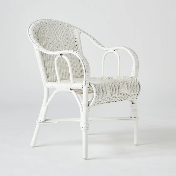 White lacquered woven rattan armchair from the Primavera collection