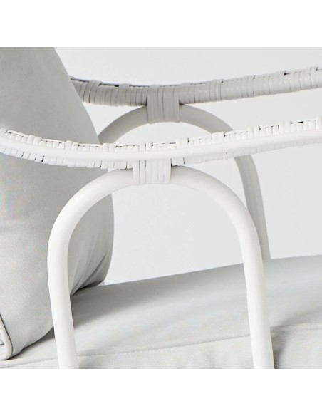 Detail of the rattan weave on the armrest of the armchair from the Primavera collection in white lacquer at Kok Maison.
