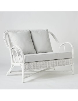 White lacquered woven rattan two-seater sofa with cushions from the Primavera collection at Kok Maison