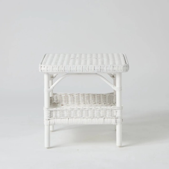 Front view of square white lacquered rattan coffee table at KOK MAISON