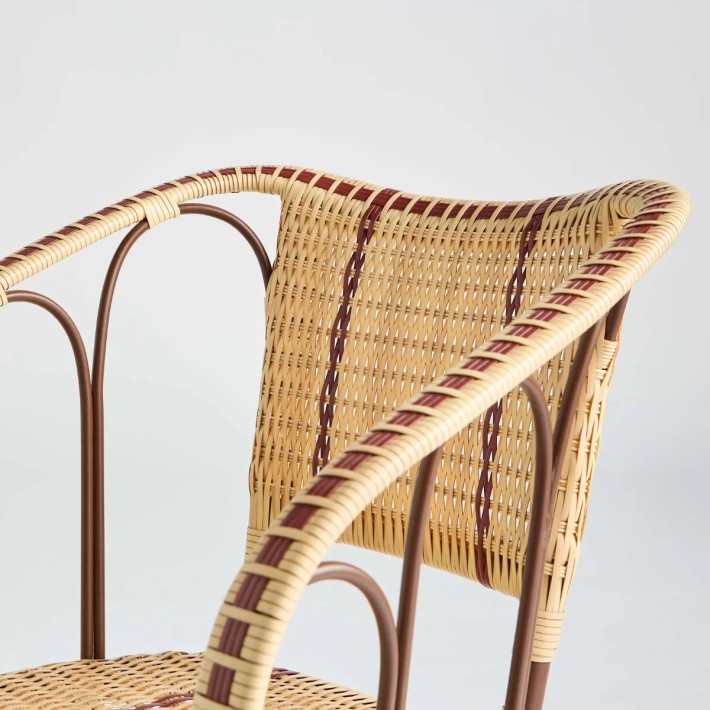 Zoom on the Belle Epoque outdoor table chair in woven resin with a rattan effect by KOK MAISON