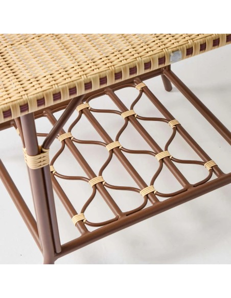 Detail under rectangular coffee table top for terrace in woven rattan-effect resin