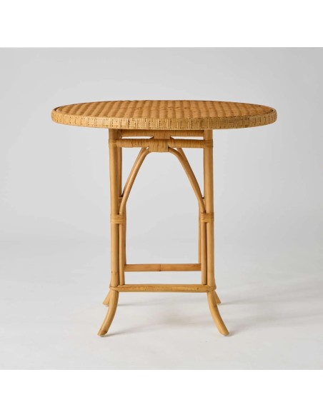 Front view of Eugénie rattan dining table/pedestal table in honey colour by Kok Maison