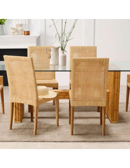 Detail of woven rattan chair backrest with teak legs from the SAIGON collection