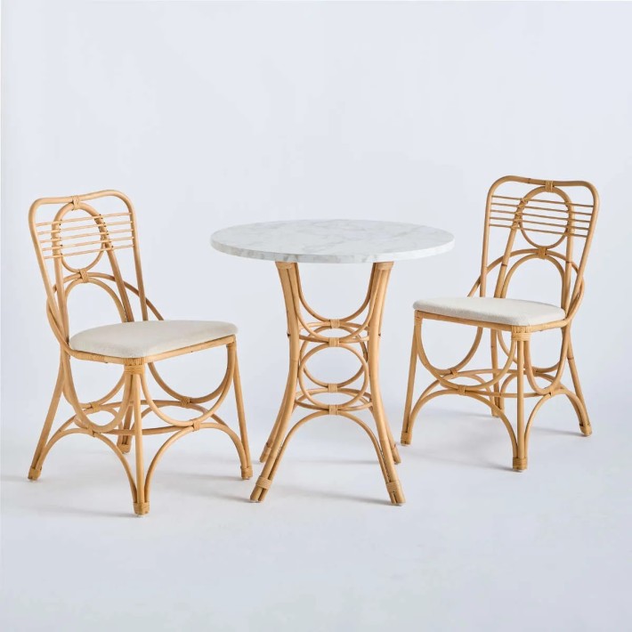Gingko Horizon rattan chairs around the Gingko rattan pedestal table