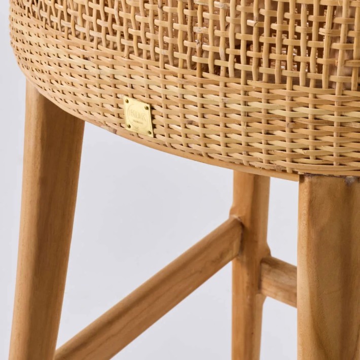 Zoom on rattan weaving and teak legs from the Saigon collection at Kok Maison