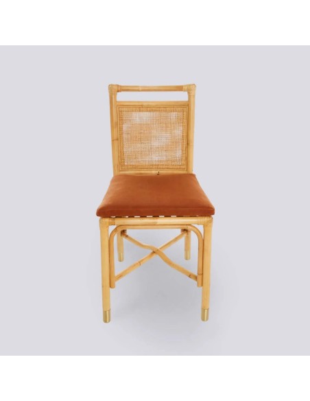 Front view of RIVIERA rattan chair with ochre velvet cushion