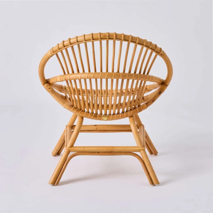 Rear view of vintage rattan shell armchair at Kok Maison