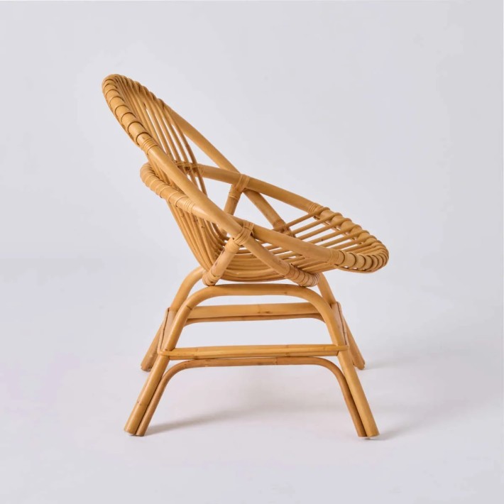 Profil fauteuil coquille en rotin vintage Brigitte