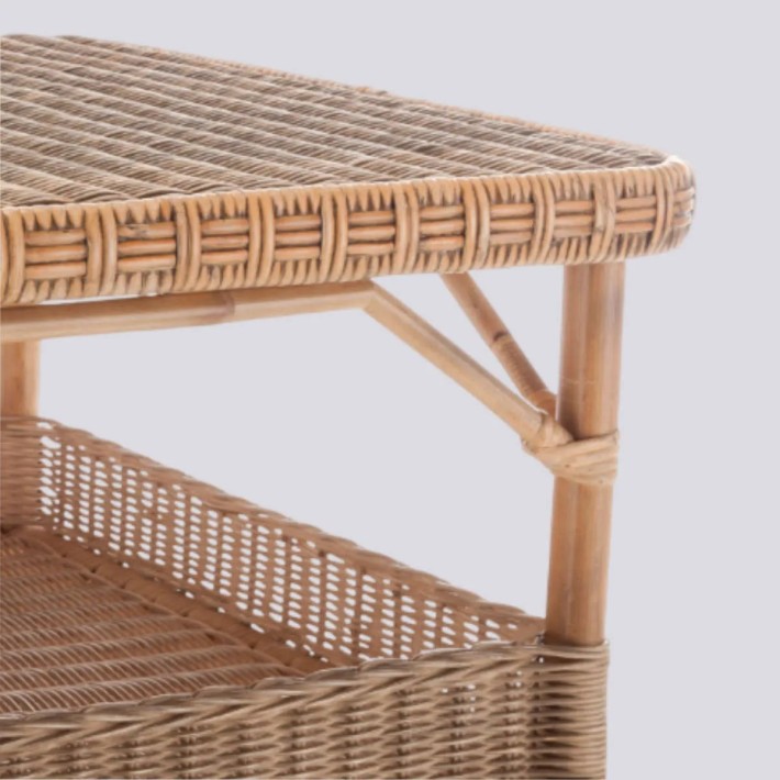 Detail of woven weathered rattan rectangular coffee table Nantucket