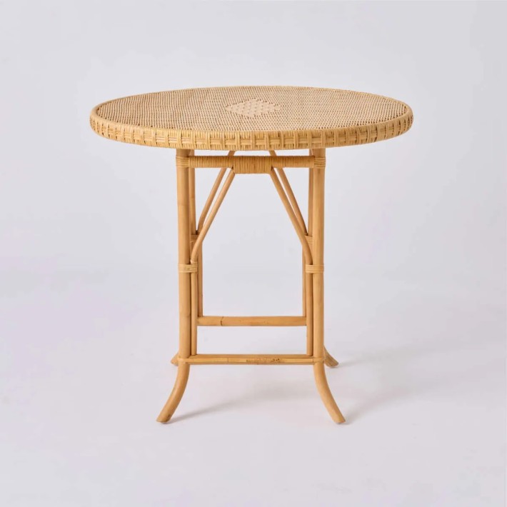 Front view of Eugénie natural rattan table from the Grandfather collection