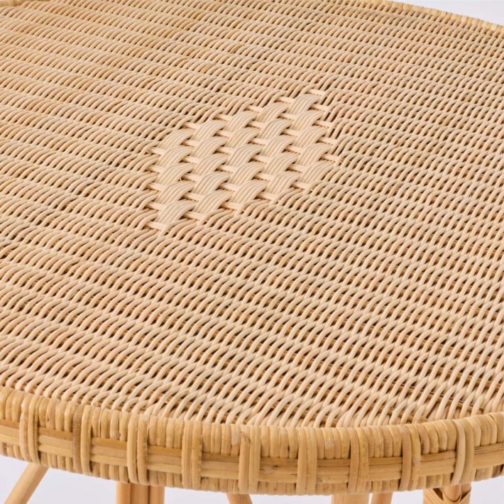 Zoom on the weave and diamond pattern of the Eugénie natural rattan table from the Grandfather collection