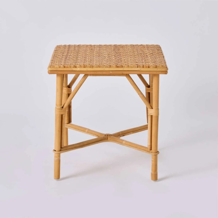 Front view of GRAND-MERE square coffee table in woven natural rattan by Kok Maison