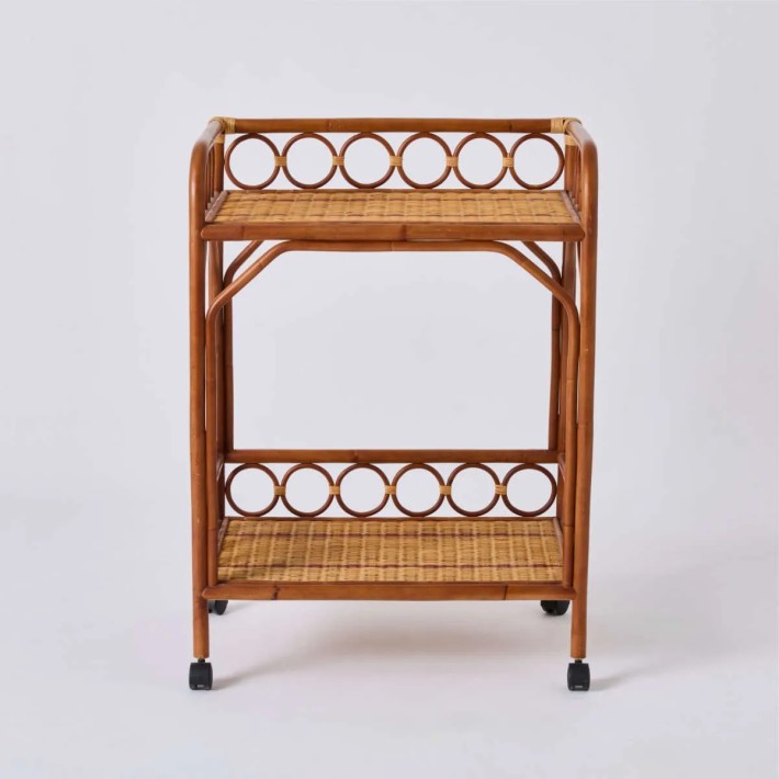 Front view of the BAGATELLE rolling trolley, made entirely of rattan by KOK MAISON