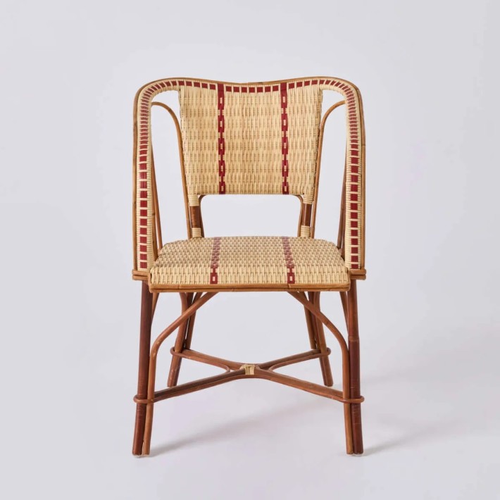 Front view of rattan frame and resin weave armchair, Bistrot style