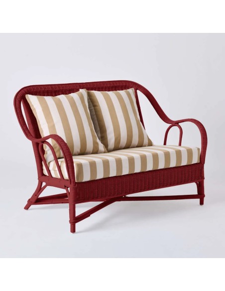 Canapé 2 places collection PRIMAVERA en rotin laqué rouge rubis avec tissu rayures beiges