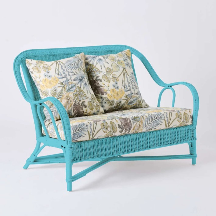 2-seater sofa from the PRIMAVERA collection in azure blue lacquered rattan with ecru bouquet fabric