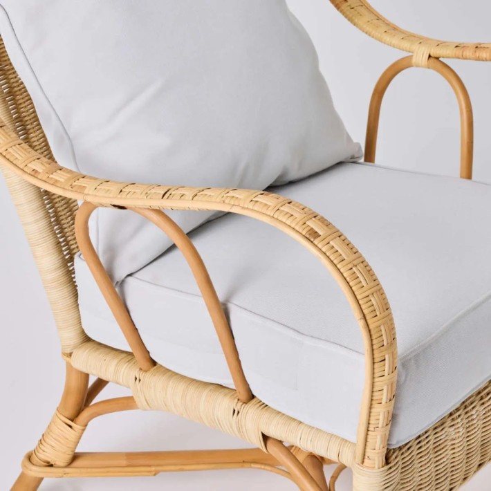 Detail of natural woven rattan armrest on NANTUCKET armchair from the Grandfather collection by KOK MAISON