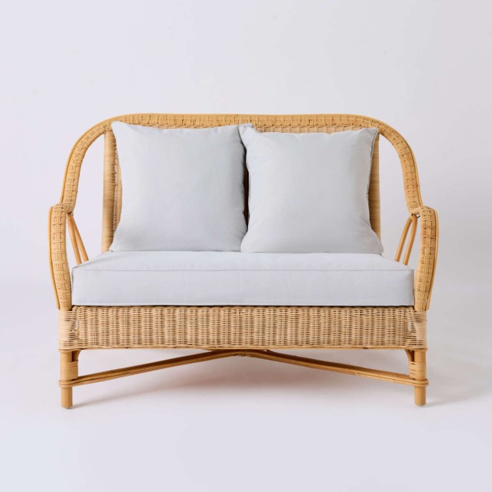 Front view of NANTUCKET natural rattan sofa from the Grandfather collection in pearl grey fabric