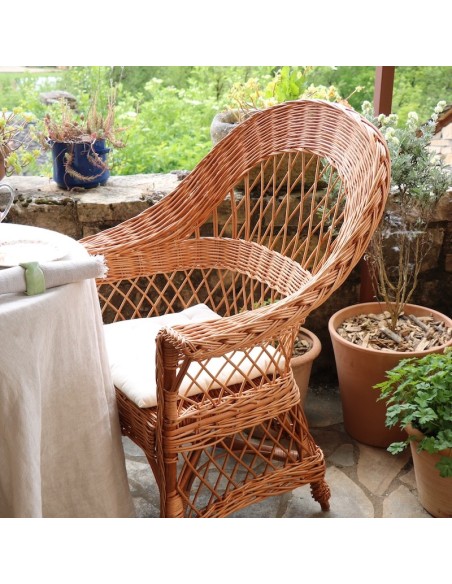 Tom wicker armchair on a covered terrace by Mélanie Charles