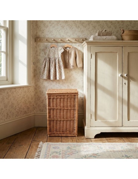 Small brown wicker laundry basket